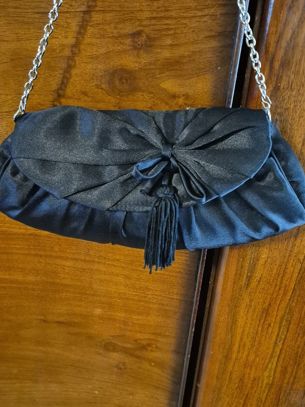 Vintage: A black satin foldover evening bag. Satin Bow& Rusch Pleating &tassels
